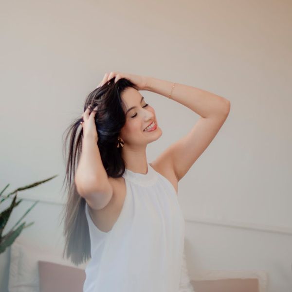 Person meditating in a bright, clean space, feeling serene.